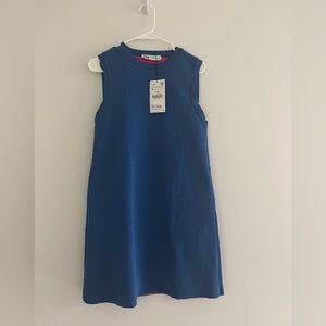 The stunning blue brand-new blue dress with playful pink interior